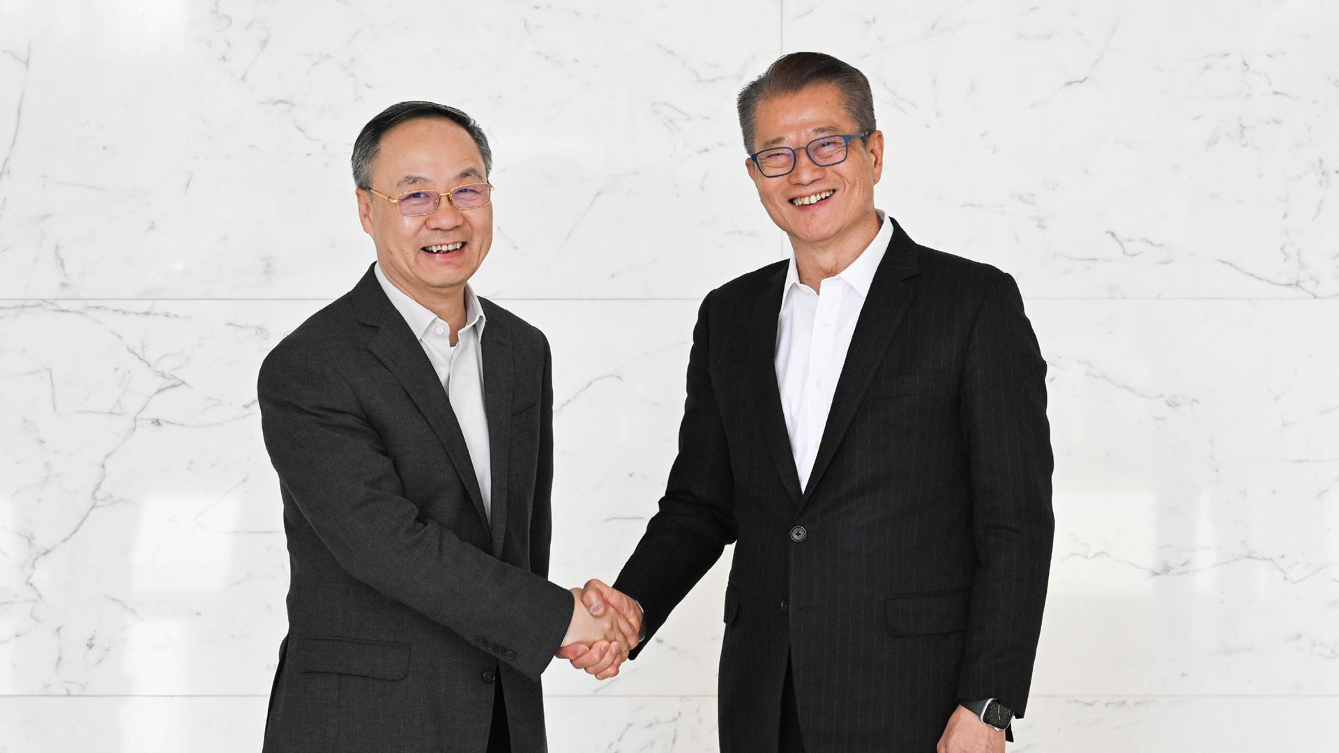 陳茂波北京會見金監總局局長李雲澤